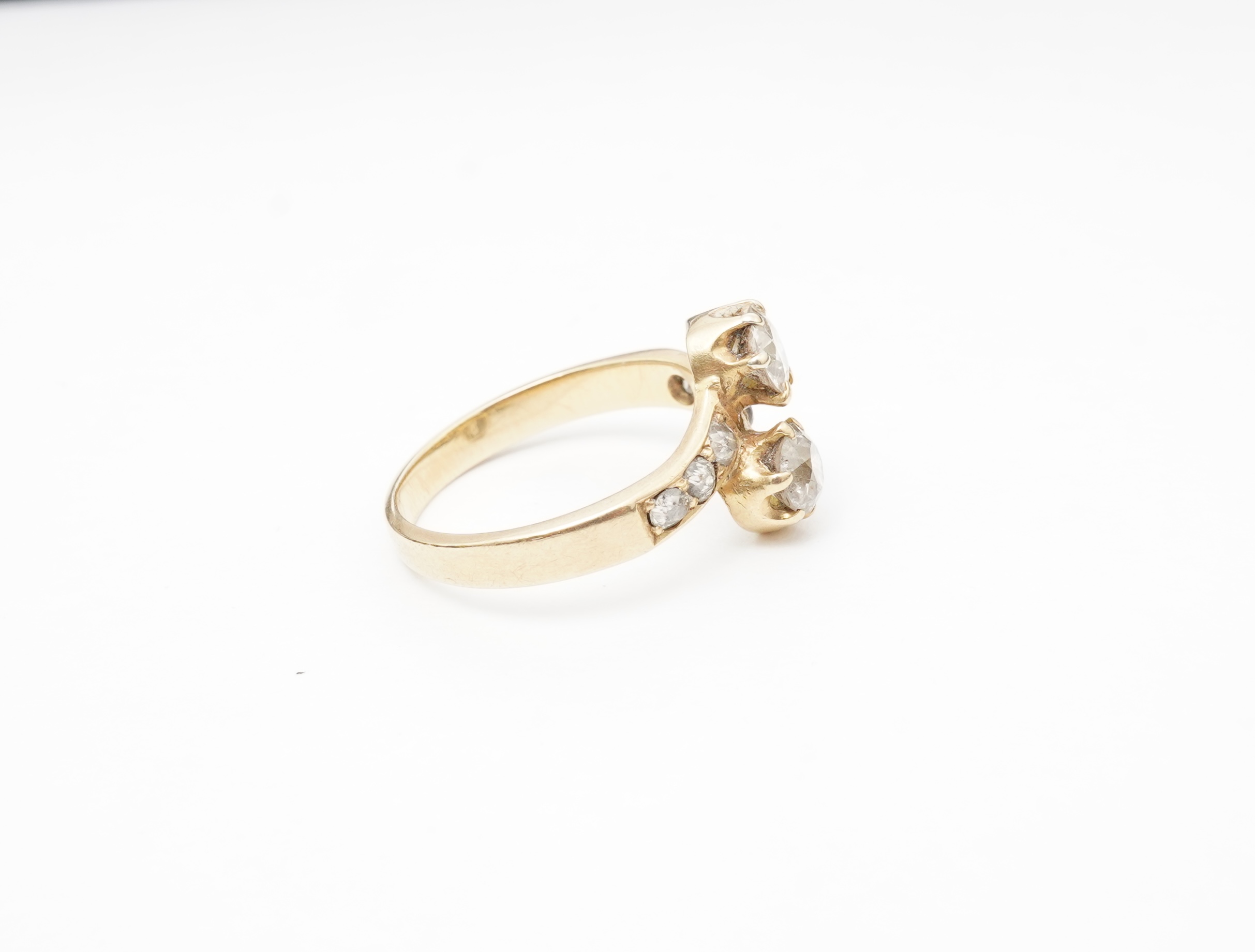 A gold and diamond 'toi-et-moi' ring, circa 1900